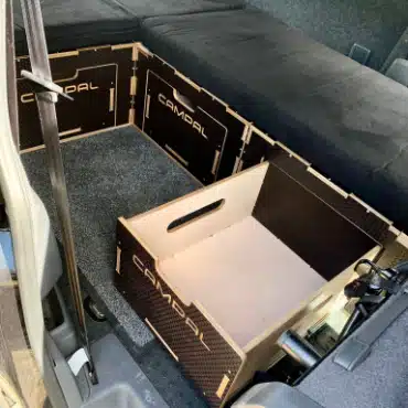 Removable birch plywood storage box extracted from Campal modular camper unit showing easy access and construction.
